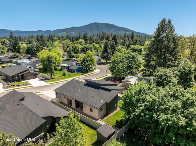1456 E Ezra Ave, Hayden, ID 83835 - aerial view of residential area with a forest and a mountain backdrop