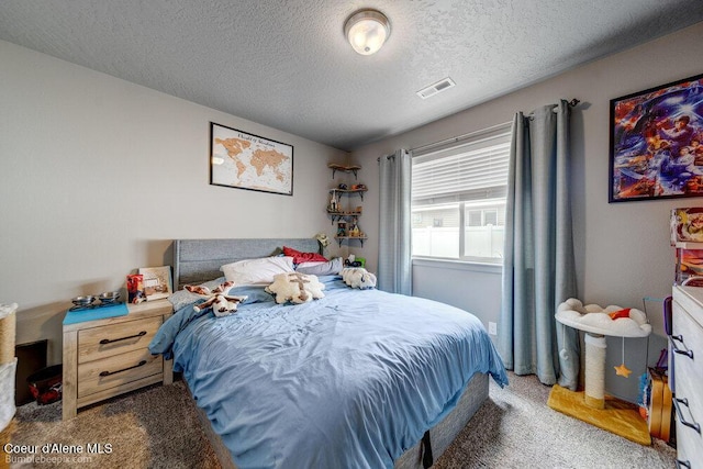 7156 W Christine St, Rathdrum, ID 83858 - carpeted bedroom with a textured ceiling