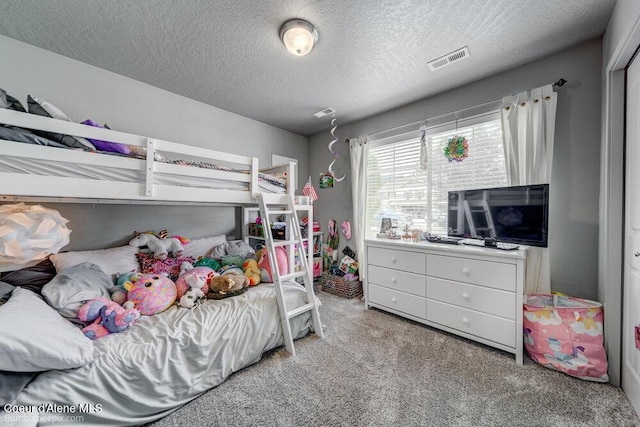 7156 W Christine St, Rathdrum, ID 83858 - carpeted bedroom featuring a textured ceiling