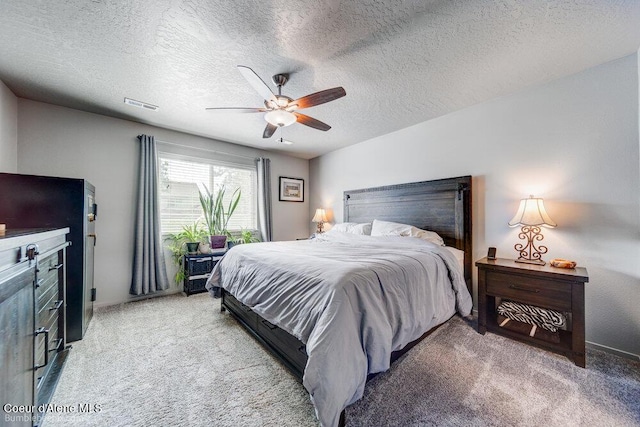 7156 W Christine St, Rathdrum, ID 83858 - bedroom with light carpet, a textured ceiling, and a ceiling fan
