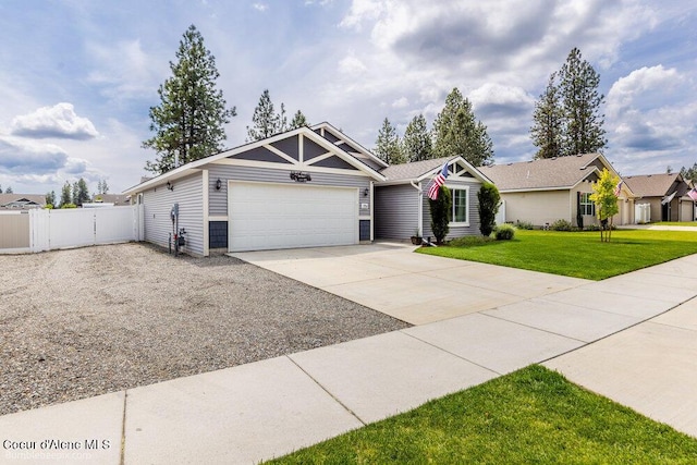 7156 W Christine St, Rathdrum, ID 83858 - view of front of house with an attached garage and concrete driveway