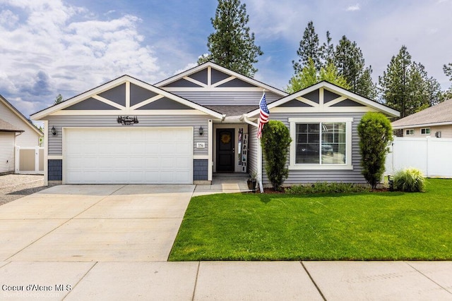 7156 W Christine St, Rathdrum, ID 83858 - view of front facade with a garage and concrete driveway