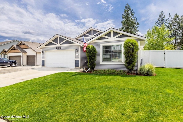 7156 W Christine St, Rathdrum, ID 83858 - view of front of house featuring a garage and concrete driveway