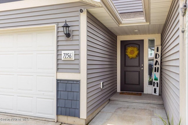7156 W Christine St, Rathdrum, ID 83858 - doorway to property featuring a garage