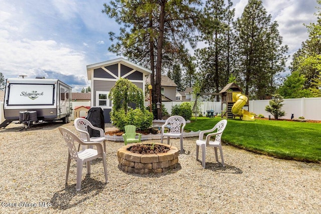 7156 W Christine St, Rathdrum, ID 83858 - view of patio featuring an outdoor fire pit and a playground