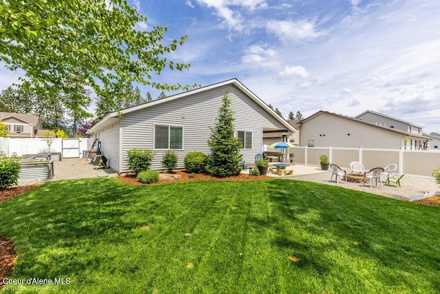7156 W Christine St, Rathdrum, ID 83858 - back of property featuring a patio area