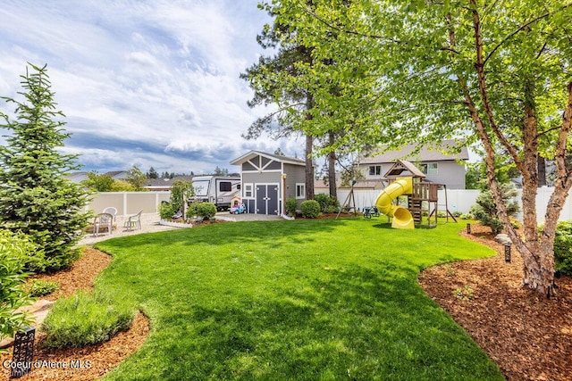 7156 W Christine St, Rathdrum, ID 83858 - view of yard featuring a playground and an outdoor structure