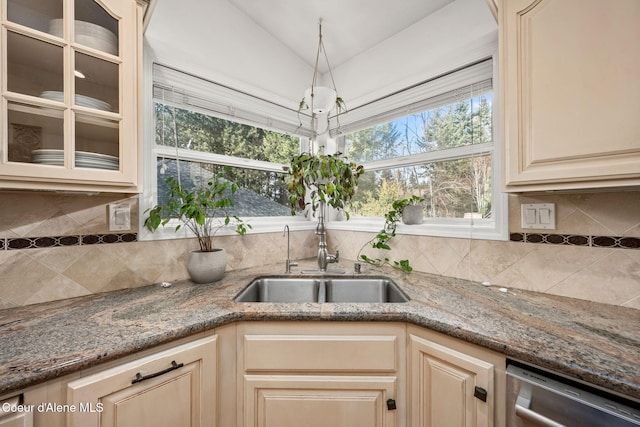 3061 E Lake Forest Dr, Hayden Lake, ID 83835 - kitchen with a sink, dishwasher, light stone countertops, glass insert cabinets, and vaulted ceiling