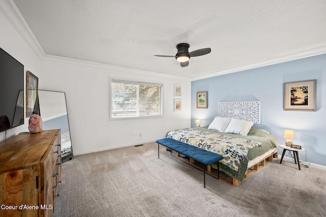 3061 E Lake Forest Dr, Hayden Lake, ID 83835 - carpeted bedroom featuring crown molding, baseboards, ceiling fan, and a textured ceiling