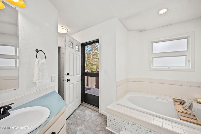 3061 E Lake Forest Dr, Hayden Lake, ID 83835 - full bathroom with vanity, a bath, and recessed lighting