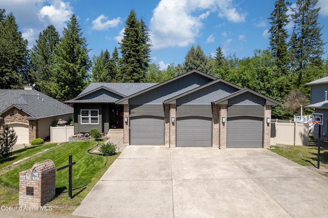3061 E Lake Forest Dr, Hayden Lake, ID 83835 - view of front of property featuring brick siding, concrete driveway, and a garage
