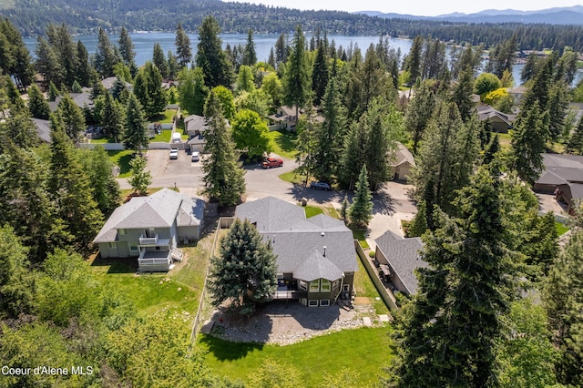 3061 E Lake Forest Dr, Hayden Lake, ID 83835 - aerial view of residential area with a heavily wooded area and a water and mountain view