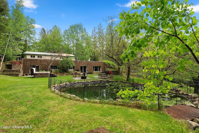 272 Hidden Springs Rd, Sandpoint, ID 83864 - view of green lawn with a patio area