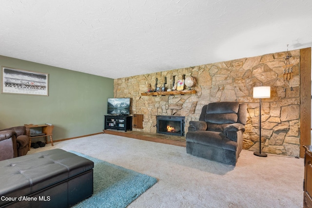 272 Hidden Springs Rd, Sandpoint, ID 83864 - carpeted living room featuring a fireplace and a textured ceiling