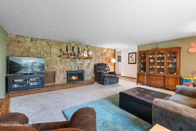 272 Hidden Springs Rd, Sandpoint, ID 83864 - living area featuring a fireplace, a textured ceiling, and carpet floors