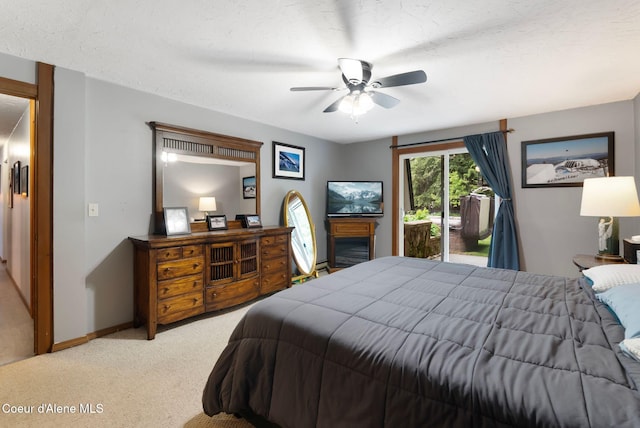 272 Hidden Springs Rd, Sandpoint, ID 83864 - bedroom with access to outside, light colored carpet, baseboards, and a ceiling fan