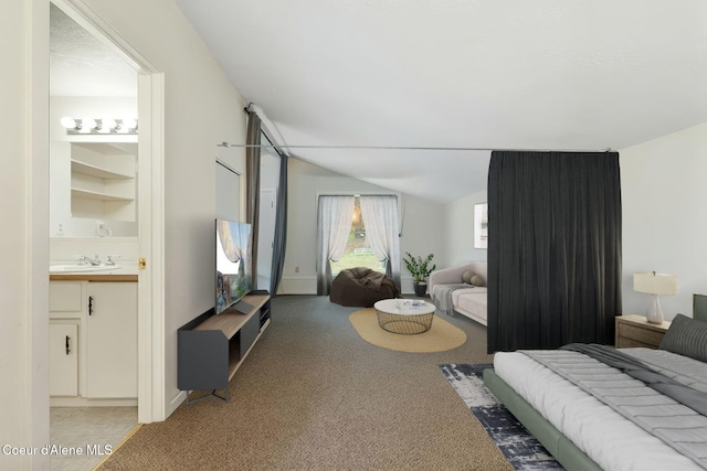 272 Hidden Springs Rd, Sandpoint, ID 83864 - bedroom featuring light carpet, vaulted ceiling, ensuite bath, and a sink