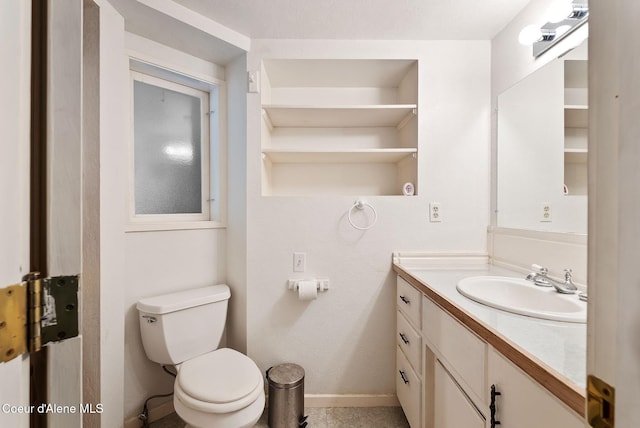 272 Hidden Springs Rd, Sandpoint, ID 83864 - half bath featuring vanity, toilet, and baseboards