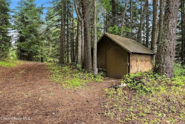 272 Hidden Springs Rd, Sandpoint, ID 83864 - garage with a shed and a forest view