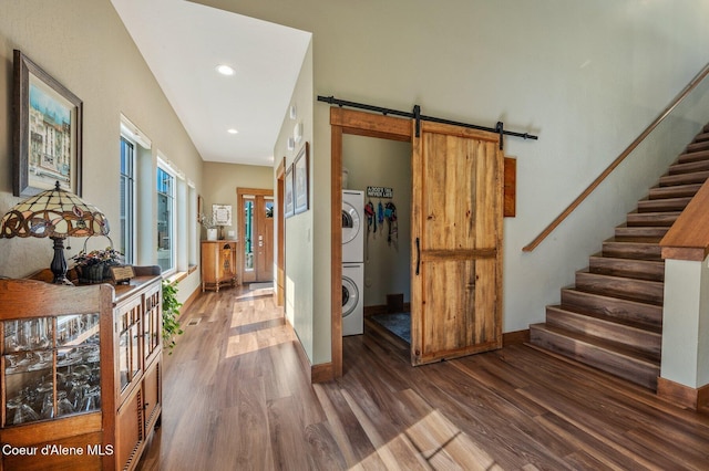 1803 W Felton Dr, Coeur Dalene, ID 83814 - corridor with a barn door, stacked washer / dryer, wood finished floors, stairs, and recessed lighting