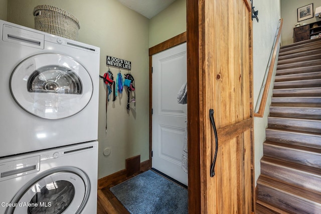 1803 W Felton Dr, Coeur Dalene, ID 83814 - laundry room with stacked washer and clothes dryer, dark wood-style flooring, and baseboards
