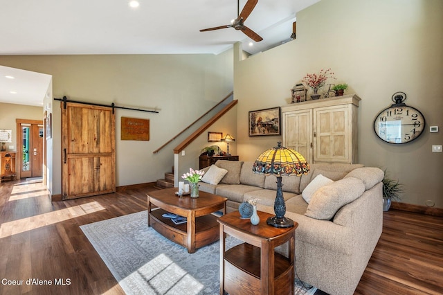 1803 W Felton Dr, Coeur Dalene, ID 83814 - living area featuring lofted ceiling, ceiling fan, a barn door, baseboards, and wood finished floors