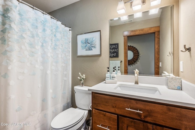 1803 W Felton Dr, Coeur Dalene, ID 83814 - full bath featuring vanity, toilet, a textured wall, and curtained shower