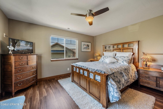 1803 W Felton Dr, Coeur Dalene, ID 83814 - bedroom featuring dark wood finished floors, baseboards, and a ceiling fan