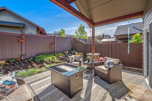 1803 W Felton Dr, Coeur Dalene, ID 83814 - fenced backyard featuring a patio area and an outdoor living space with a fire pit