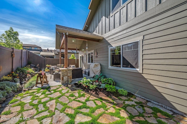 1803 W Felton Dr, Coeur Dalene, ID 83814 - fenced backyard with a patio area and an outdoor hangout area