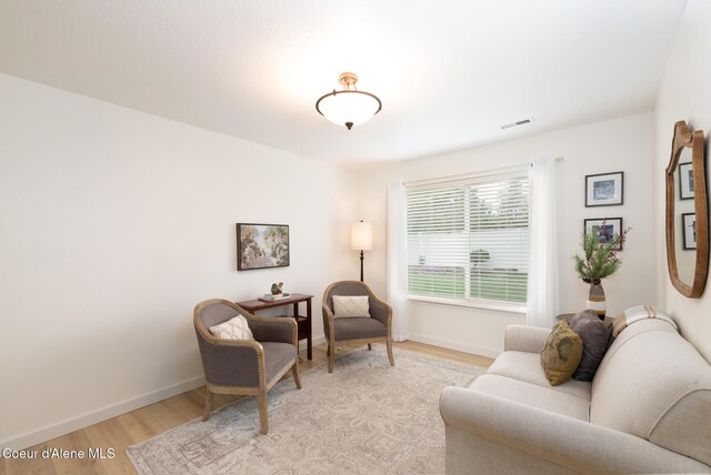 9105 N Prescott Dr, Hayden, ID 83835 - living area with light wood-type flooring and baseboards
