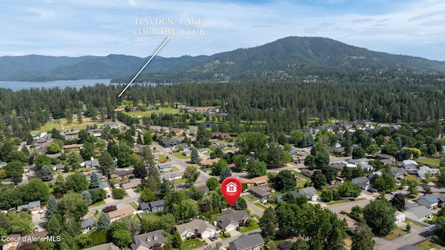 10016 N Zack Ct, Hayden, ID 83835 - aerial view of property's location with a mountain backdrop and nearby suburban area