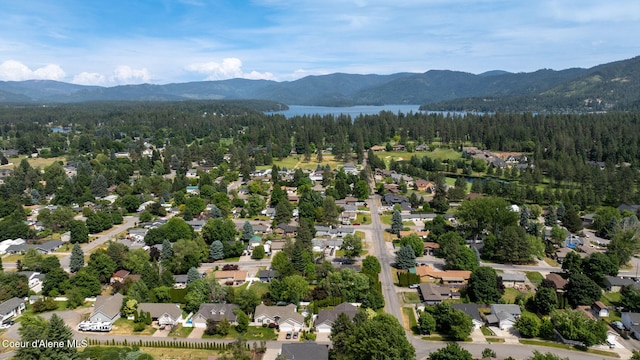 10016 N Zack Ct, Hayden, ID 83835 - aerial view of residential area with a water and mountain view and a heavily wooded area