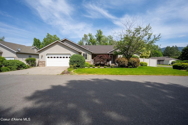 10016 N Zack Ct, Hayden, ID 83835 - view of front facade featuring driveway and a garage