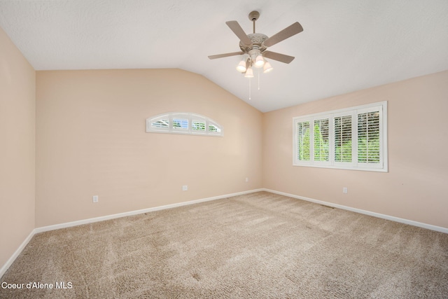 10016 N Zack Ct, Hayden, ID 83835 - carpeted spare room with vaulted ceiling and a ceiling fan