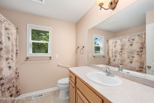 10016 N Zack Ct, Hayden, ID 83835 - bathroom with vanity, tile patterned flooring, and a shower with shower curtain