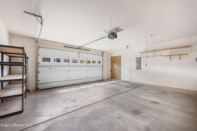 10016 N Zack Ct, Hayden, ID 83835 - garage with electric panel and a garage door opener