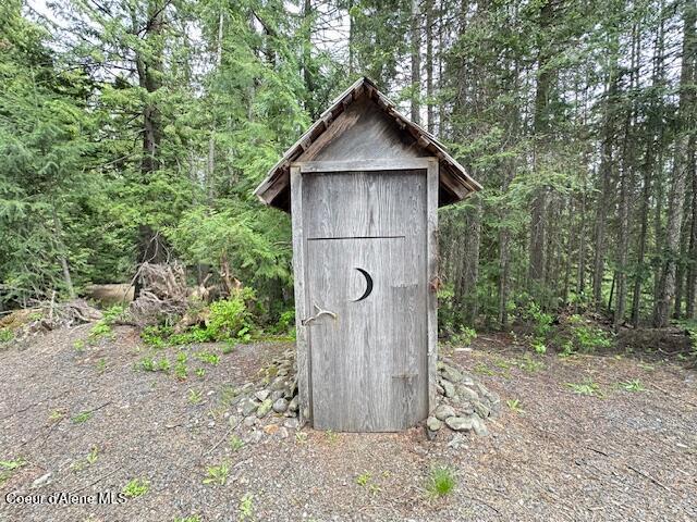 474 NW Fork Santa Creek Rd, Emida, ID 83861 - view of shed with a wooded view
