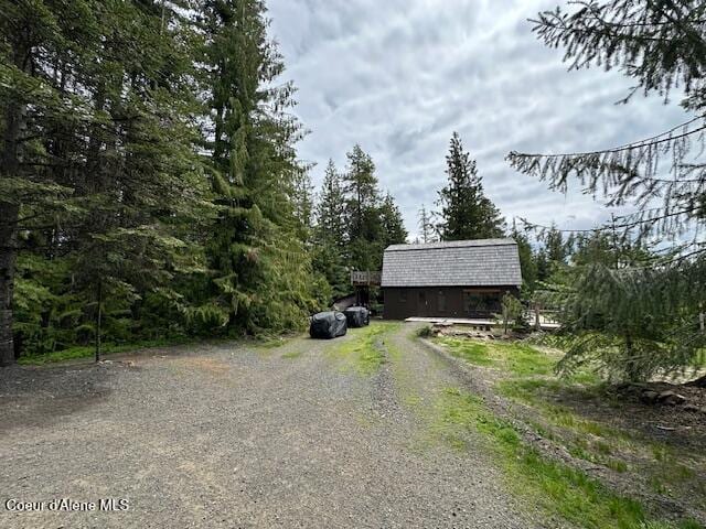 474 NW Fork Santa Creek Rd, Emida, ID 83861 - view of dirt / gravel driveway with a forest view