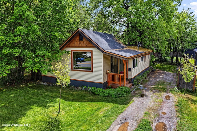 913 Cedar St, Sandpoint, ID 83864 - view of front of house with driveway and a front lawn