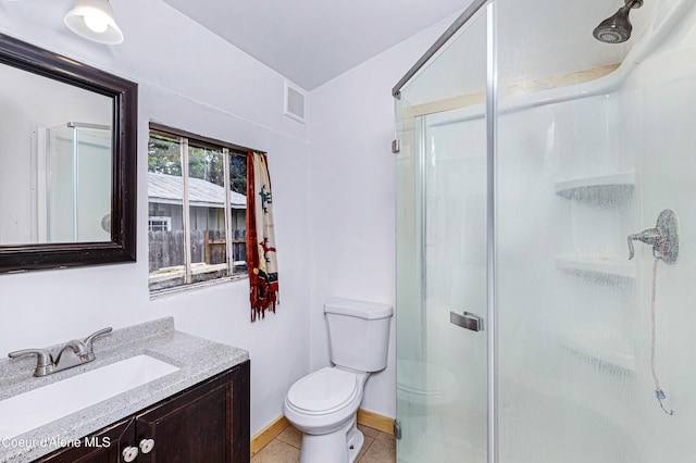 913 Cedar St, Sandpoint, ID 83864 - full bath with a shower stall, vanity, toilet, and tile patterned flooring