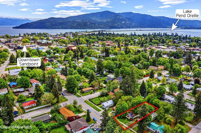 913 Cedar St, Sandpoint, ID 83864 - aerial view of residential area with property parcel outlined and a water and mountain view
