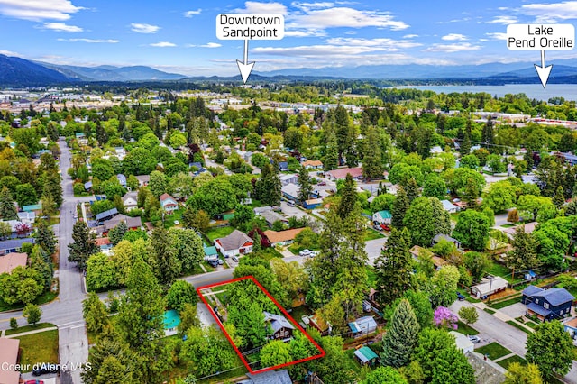 913 Cedar St, Sandpoint, ID 83864 - aerial perspective of suburban area with property boundaries highlighted and a mountainous background