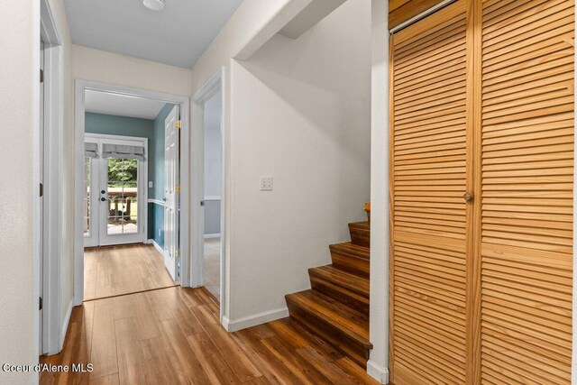 31716 N Middle Ave, Spirit Lake, ID 83869 - hallway featuring wood finished floors, stairway, and baseboards