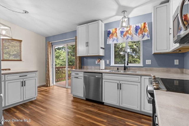 31716 N Middle Ave, Spirit Lake, ID 83869 - kitchen featuring stainless steel appliances, a sink, light countertops, dark wood finished floors, and lofted ceiling