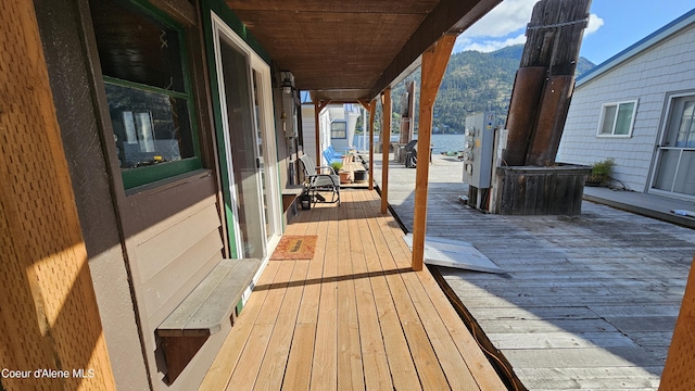 33671 N Macdonalds Unit 2Nd, Dock, Bayview, ID 83803 - wooden deck featuring a water and mountain view