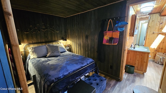 33671 N Macdonalds Unit 2Nd, Dock, Bayview, ID 83803 - bedroom with wood finished floors, a sink, wood walls, and wood ceiling
