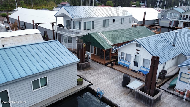 33671 N Macdonalds Unit 2Nd, Dock, Bayview, ID 83803 - rear view of house with metal roof, a deck, and a residential view