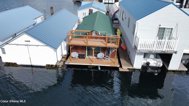 33671 N Macdonalds Unit 2Nd, Dock, Bayview, ID 83803 - rear view of house featuring a water view and metal roof