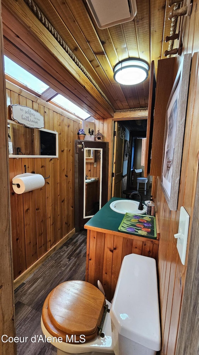 33671 N Macdonalds Unit 2Nd, Dock, Bayview, ID 83803 - bathroom with wood walls, wood finished floors, vanity, and wooden ceiling